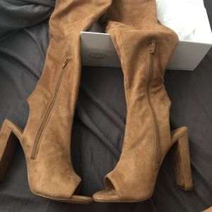 Camel over-the-knee boots.